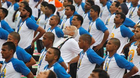 India's Prime Minister Narendra Modi (C) performs yoga during World Yoga Day in Chandigarh, India, June 21, 2016. REUTERS/Ajay Verma