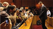 ‘Pistorius smashed toilet door with bat to reach wounded Reeva’