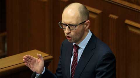 Comments from Arseniy Yatsenyuk came as a convoy of Russian troops rolled toward Simferopol. (AP)