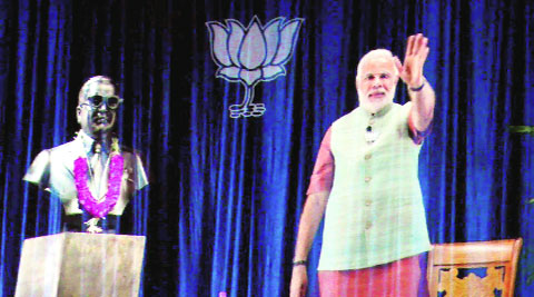 Narendra Modi addresses supporters through 3D video link in Allahabad on Monday. PTI