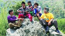Strumming a tune atop a hillock is Tanuj Virwani 
with his co-stars .