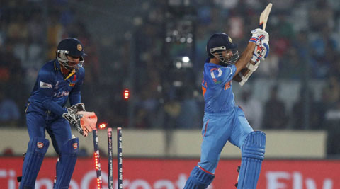 India's batsman Ajinkya Rahane, right, is bowled out by Sri Lanka's bowler Angelo Mathews. (AP)