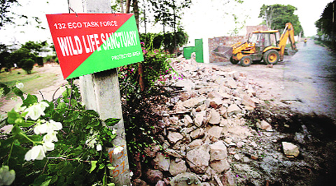 The boundary wall of a farmhouse being demolished. (Praveen Khanna) 