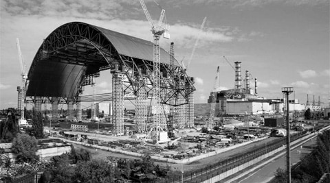 The first half of the New Safe Confinement, or NSC, the arch that will cover the reactor building, is seen after it was pushed to a site at the Chernobyl nuclear power plant late last year. NYT