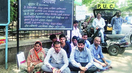 Meenakshi Magar at a dharna outside MSEDCL office along with her relatives on Wednesday.