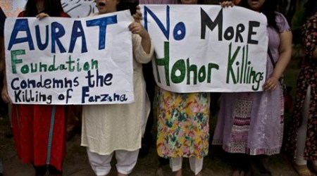 Members of Pakistan's civil society, hold banners and chant slogans, during a protest to condemn the killing of pregnant woman Farzana Parveen, who was stoned to death, in Islamabad, Pakistan. (Source: AP)