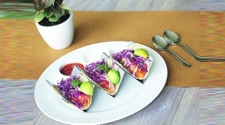 The restaurant is split into two levels, bound together by the wood-and-metal spiral staircase of dreamy Hollywood sets. 