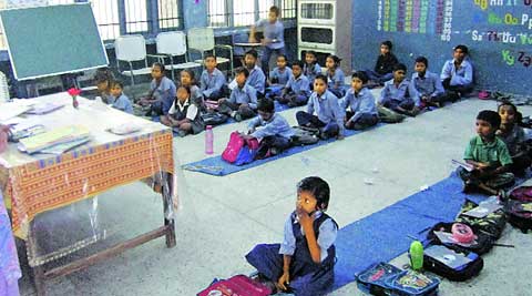 Students sit on the floor at a government school in Mohali. (Gagandeep Singh Dhillon)