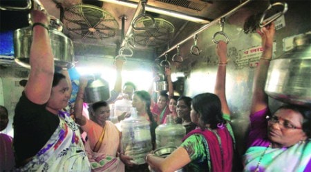 Women travel on local trains to fetch water; containers lined up at the Mumbra railway station. 