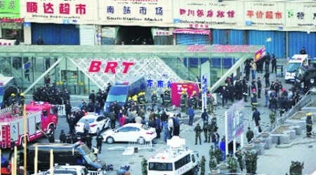 Security personnel at the scene of the explosion in Urumqi Wednesday. (AP)