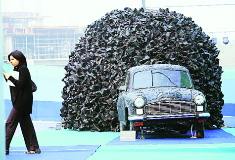 At the 2013 edition of India Art Fair, artist Mahbubur Rahman’s  Replacement, a multi-media installation, had the Ambassador covered in black leather with a swarm of leather boots tumbling out of its boot.