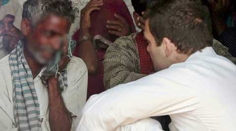 Rahul Gandhi interacts with family members of two sisters who were gangraped and hanged from a tree at Katra Shahadatganj village, in Badaun district. (Source: PTI)