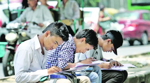 Students fill admission forms at North Campus on Monday. (Source: Ravi Kanojia)