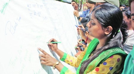 A signature campaign for ‘Save Trees’ on World Environment Day in Lucknow on Thursday. (Express Photo: Vishal Srivastav)  