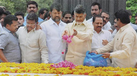  N Chandrababu Naidu offers floral tribute to late NT Rama Rao before swearing-in as the new Chief Minister of Andhra Pradesh at the Necklace Road in Hyderabad on Sunday. (Source: PTI) 
