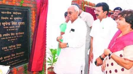 Haryana Chief Minister Bhupinder Singh Hooda lays foundation for Narnaul Bypass Road in Mahendergarh on Friday. Health Minister Rao Narender Singh and CPS Anita Yadav look on. 