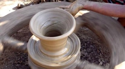 Premium Photo  Freshly made clay pot on a potters wheel