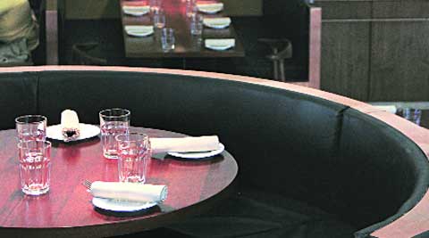 comfort food: Dark furniture and bronzed lamps make up the interiors.