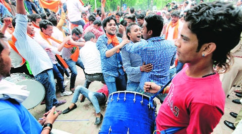 (Top) ABVP activists celebrate the UGC order on Monday. (Above) A protest on the campus
