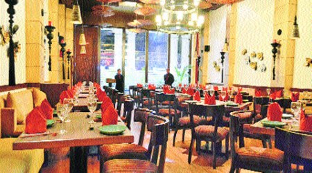 The split-level restaurant resembles the set of a period film on the Far East, modified to modern sensibilities.