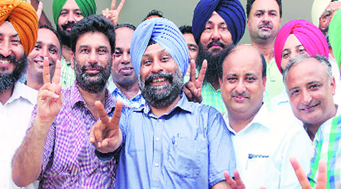 Jubilant K S Sangha (centre) with the group after winning the PAUTA election in Ludhiana on Tuesday. Gurmeet Singh