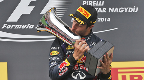 Red Bull's Daniel Ricciardo kisses the Hungarian GP trophy. (Source: AP) 