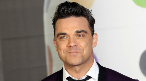 Robbie Williams is currently on the UK leg of his 'Swings Both Ways' tour. (Source: AP)