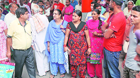 Patients wait outside the emergency block after the shooting at GMSH-16 on Friday.