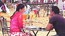 Kareena Kapoor Khan and Ajay Devgn take a breather in between shots