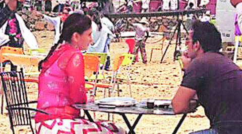 Kareena Kapoor Khan and Ajay Devgn take a breather in between shots