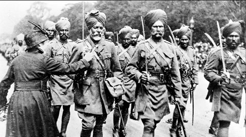 A French woman pins a flower on Sikh soldiers in Paris.