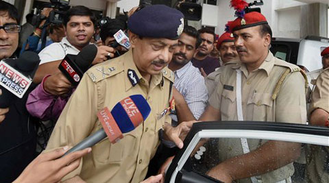 Uttar Pradesh DGP A L Banerjee comes out of the annexe after meeting Chief Minister Akhilesh Yadav about the gruesome rape and murder of a woman in Mohanlalganj area in Lucknow on Friday. (Source: PTI)