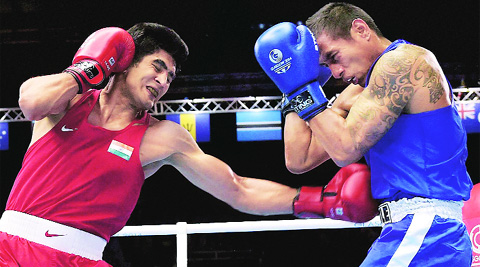 Vijender Singh and Andrew Kometa in action in the men’s middle 75kg bout in Glasgow on Saturday. Source: PTI 