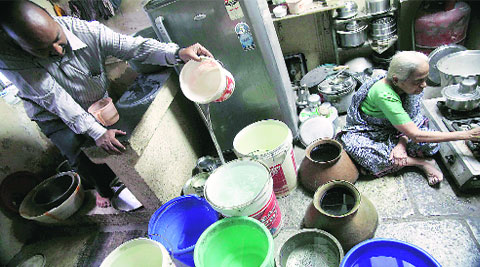 A family stores water in utensils and buckets on Wednesday. (Express/Photo by Arul Horizon)