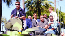 The cast of The Expendables III , Silvester Stallone, Arnold Schwarzenegger, Mel Gibson, Harrison Ford, Antonio Banderas 
and Jason Statham riding atop a tank at the Cannes Film Festival 