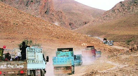 Displaced Yazidis ride trucks as they are evacuated from Mount Sinjar in Iraq Thursday. ( Source: Reuters )