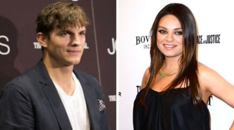Mila Kunis and Ashton Kutcher held hands during their outing. (Source: Reuters/AP)