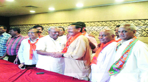 Brijesh Merja with BJP leaders at a function in Rajkot on Wednesday. (Express Photo)