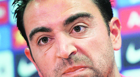 Xavi Hernandez will continue to play for Barcelona. Source:Reuters