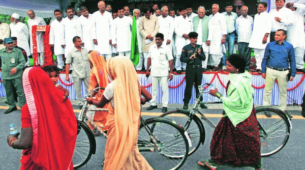 Chief Minister Akhilesh Yadav distributes bicycles to labourers at his official residence in Lucknow on Friday. (Source: Express photo by Vishal Srivastav)  