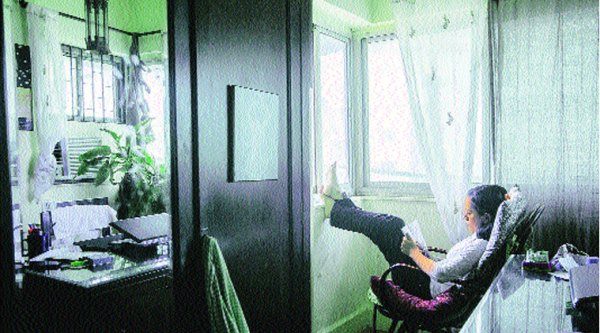 Anusha Yadav photographs people in their spaces.