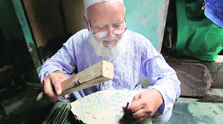 Mohammad Ayyub at work on a block of wood. (Source: Express photo by Mohammad Ayyub at work on a block of wood)