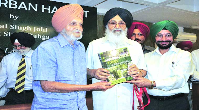 Punjab Chief Minister Parkash Singh Badal releases the book, Trees in Urban Habitat, at Golf Club in Sector 6, Chandigarh, on Wednesday.  (Source: Express photo by Sahil Walia)
