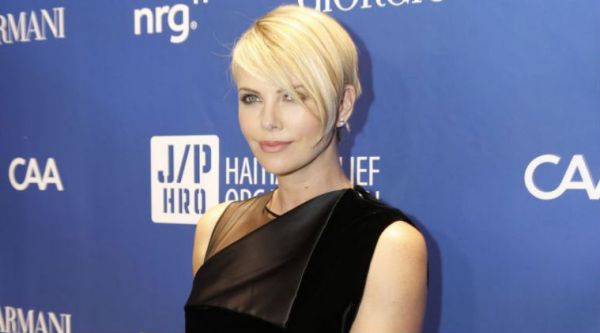 Charlize Theron says she has her moments when she does not like looking in a mirror . (Source: AP)
