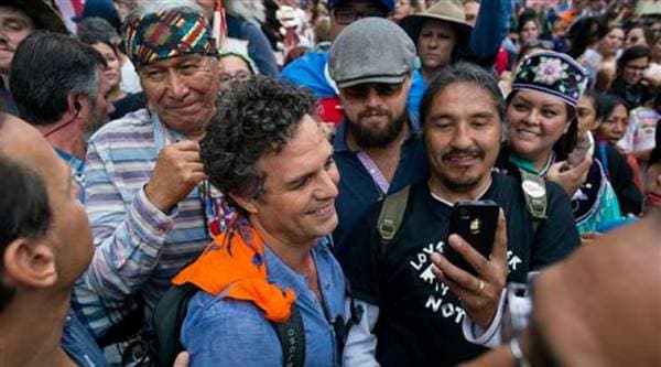 Actor and activist Mark Ruffalo, center left, and actor Leonardo DiCaprio, center right, join participants during the People's Climate March in New York Sunday, Sept. 21, 2014.