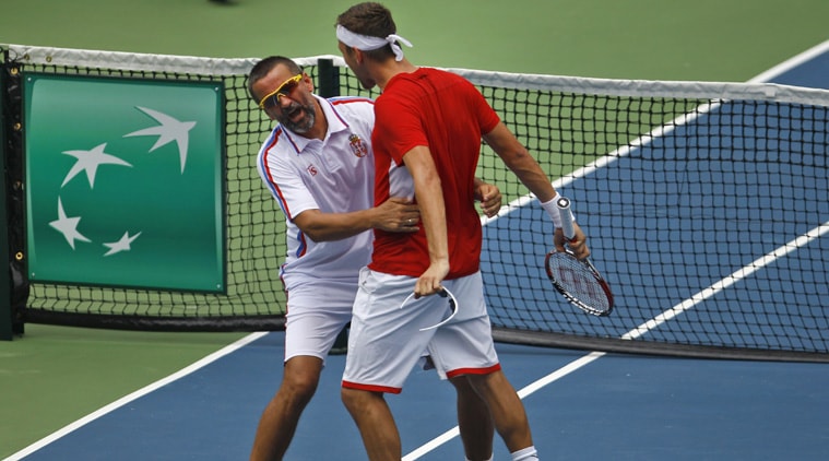 Serbia's Filip Krajinovic (R) celebrates with captain Bogdan Obradovic after his win over Yuki Bhambri. Krajinovic beat Bhambri 6-3, 6-4, 6-4 (Source: AP)