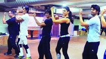 Vivaan Shah, Deepika Padukone, Shah Rukh Khan, Sonu Sood and Boman Irani  rehearse at the Red Chillies Entertainment office with  an assistant choreographer (second from left)
