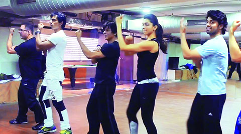 Vivaan Shah, Deepika Padukone, Shah Rukh Khan, Sonu Sood and Boman Irani  rehearse at the Red Chillies Entertainment office with  an assistant choreographer (second from left)