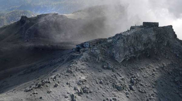 Dozens of people were killed by volcanic gases and smoke, forcing rescuers to suspend plans to try to recover at least two dozen bodies still near the summit. (Source: AP photo)
