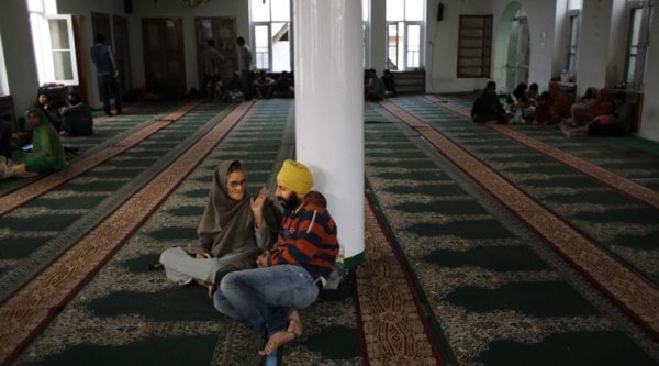 Kashmiri Sikhs, rescued by their Muslim neighbors, take shelter at a makeshift relief camp set up at a mosque in Srinagar, Indian-controlled Kashmir, Thursday, Sept. 11, 2014. (Source: AP photo)